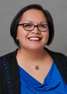 Dr. Erica Hernandez-Scott smiling in a headshot