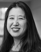 A photo of Yukari Amos smiling.